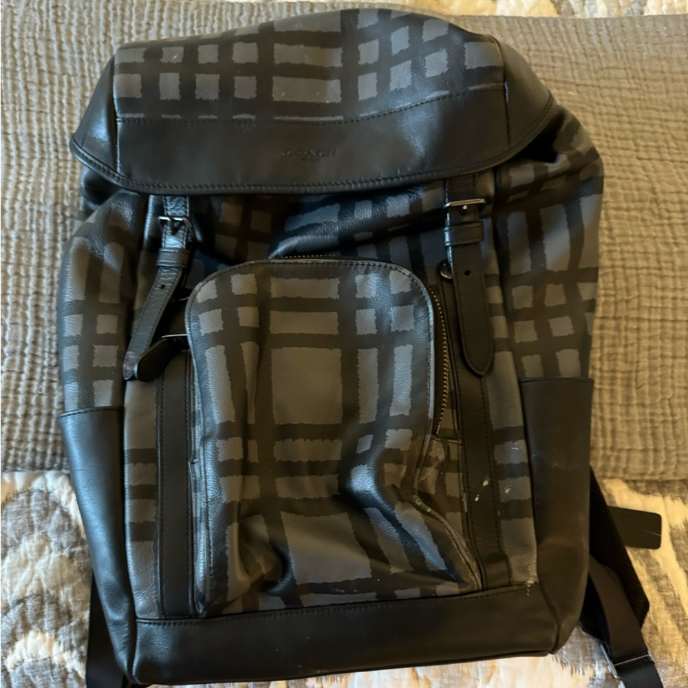 Leather Coach backpack. Black and grey plaid design. Fits laptop and lots more!
